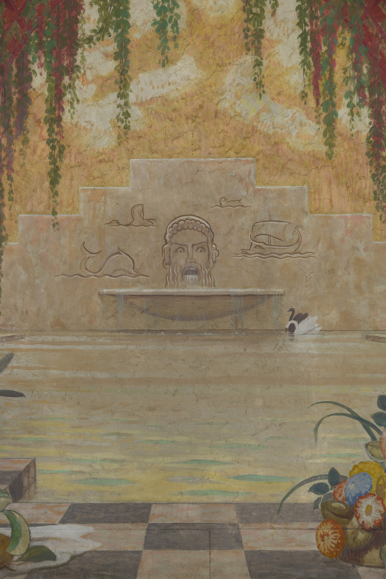 壁に描かれた彫刻の男性の口から水が流れその下に人工的な池。そこに白鳥がくつろいている。絵画