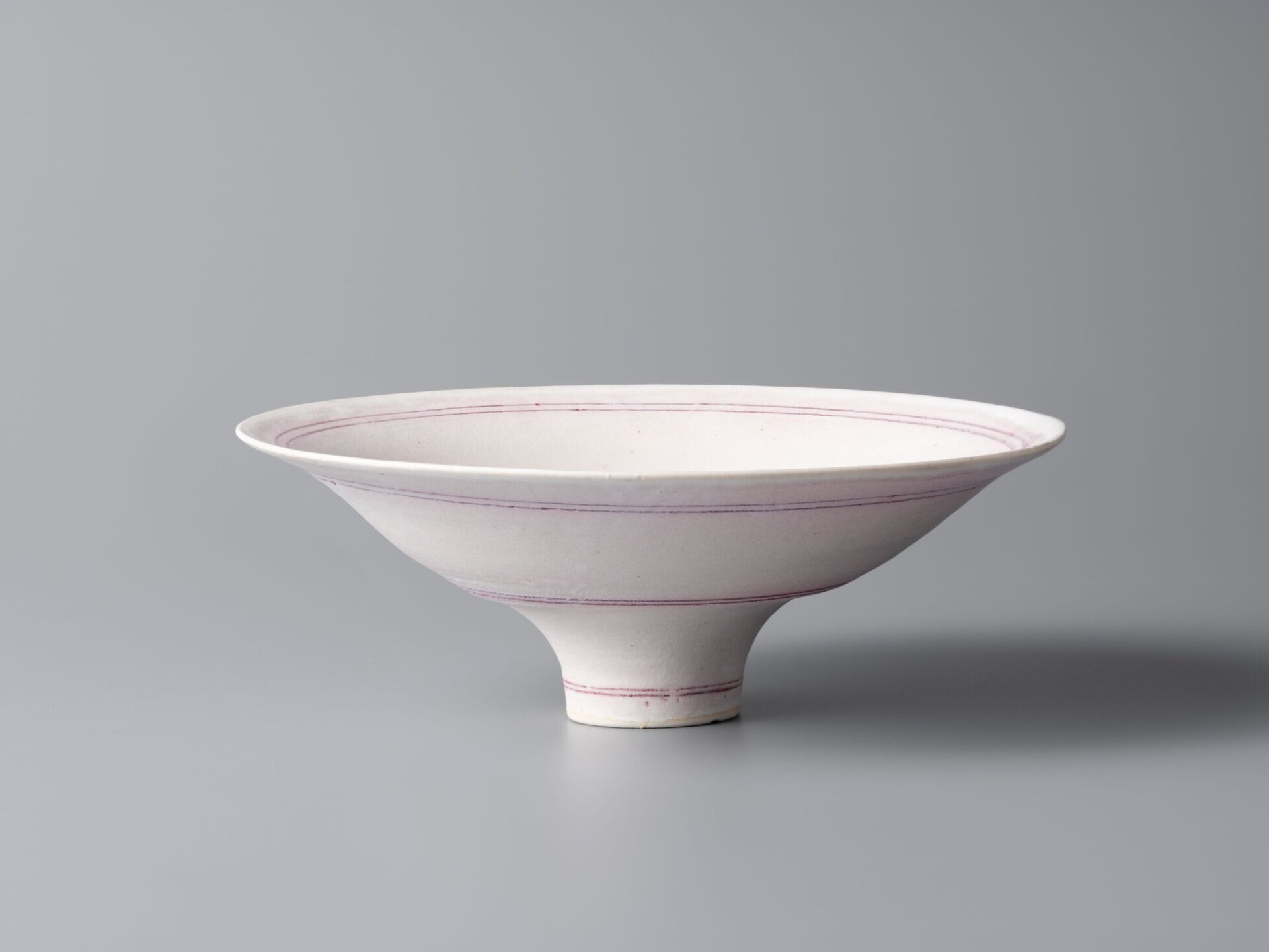 Lucie Rie, White Glazed Bowl Decorated with Pink Line, c. 1984, Iuchi Collection, deposited at the National Crafts Museum Photo: Nomura Tomoya